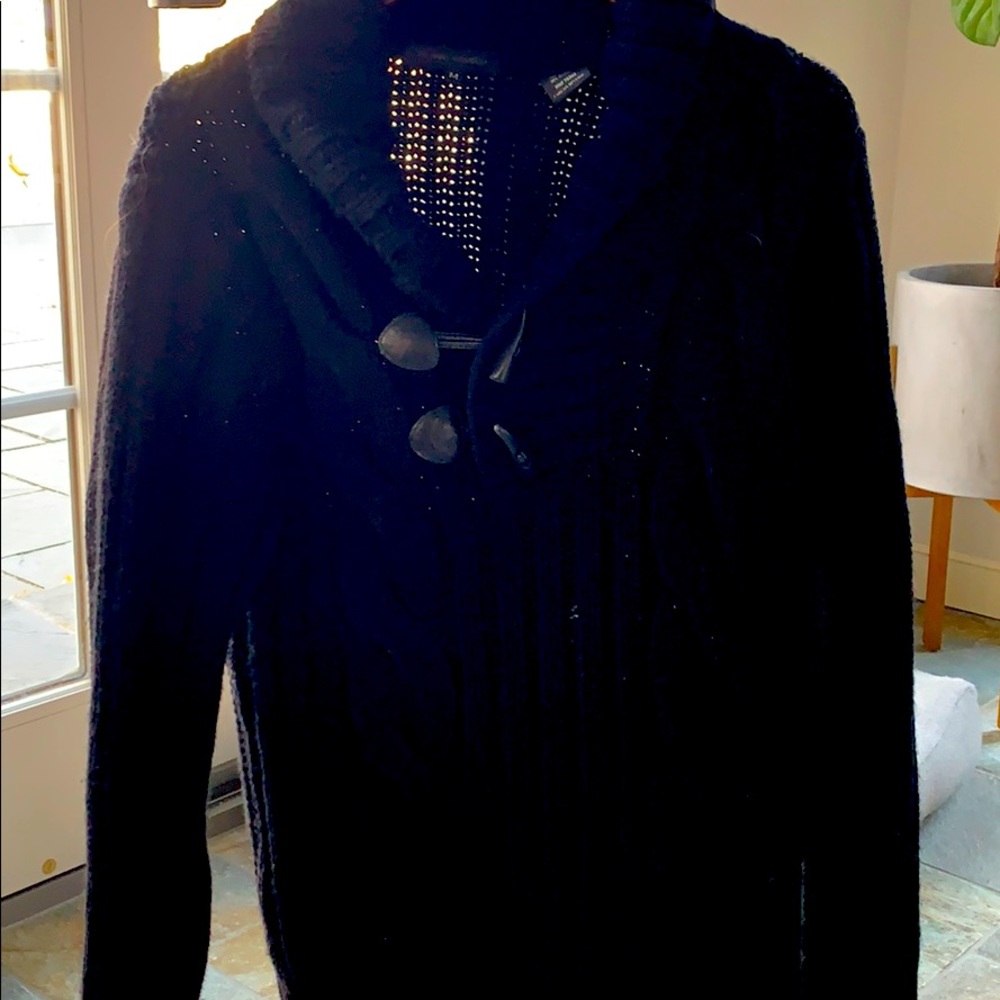 Cable knit sweater.